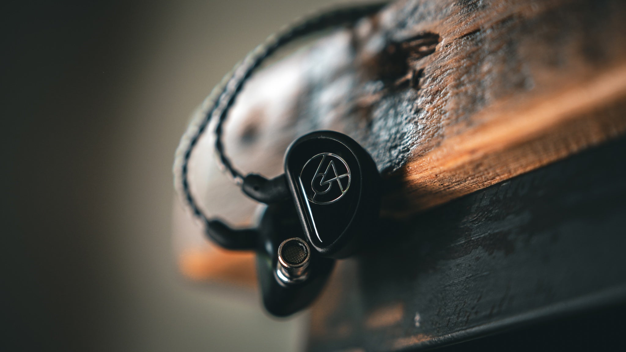 64 Audio Aspire 4 resting on a wooden stool