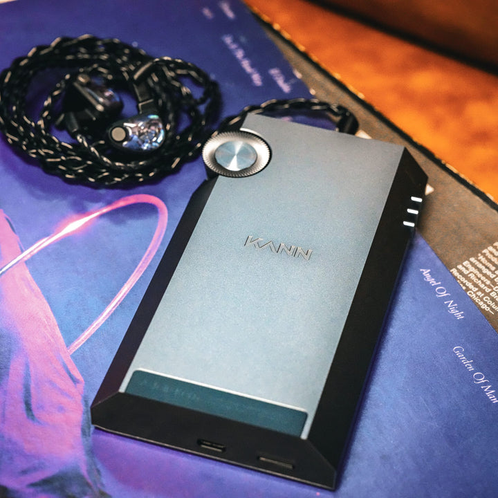 Astell&Kern KANN Ultra rear over purple vinyl record with connected earphones
