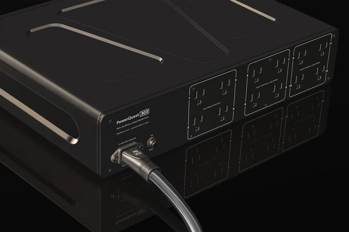 AudioQuest PowerQuest 303 Power Conditioner sitting rear left 3 quarter angle closeup on black background