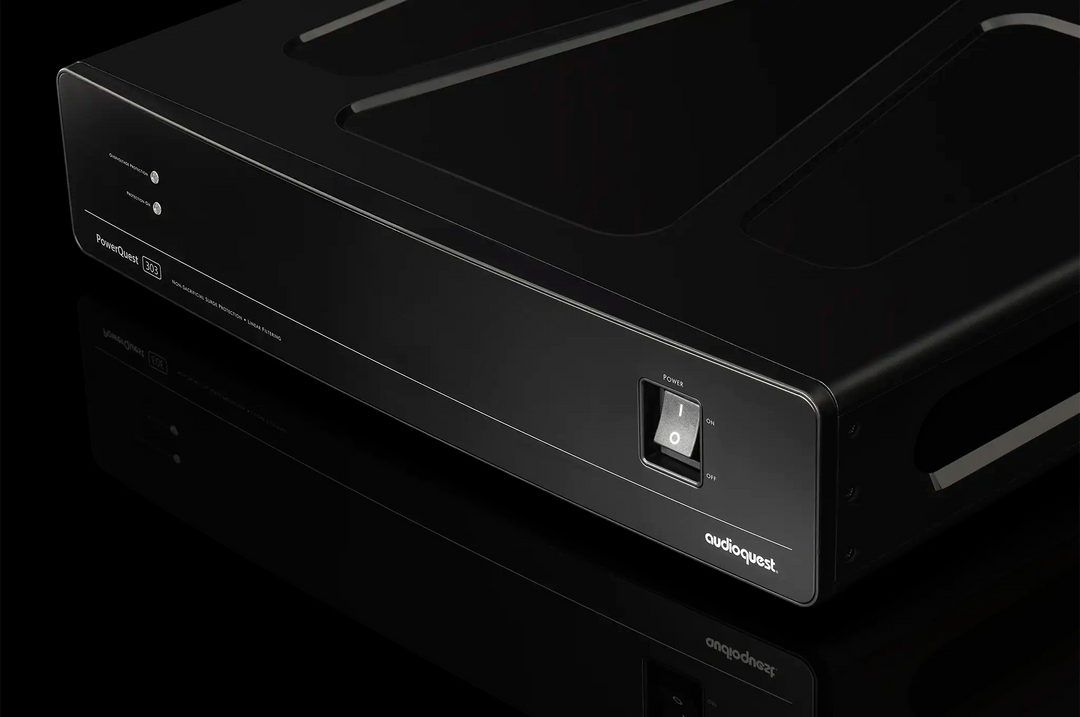 AudioQuest PowerQuest 303 Power Conditioner sitting front left 3 quarter angle closeup on black background