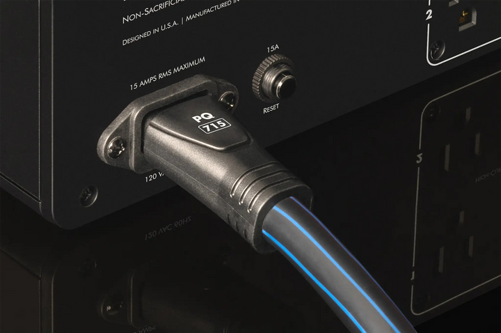 AudioQuest PowerQuest 505 Power Conditioner rear power cord inserted sitting on black background