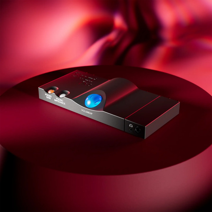 Chord Pre in black front right 3 quarter angle sitting on round stage in red lighting
