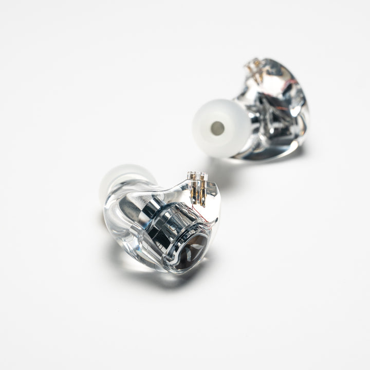 DITA Audio Project M left earphone closeup over white background