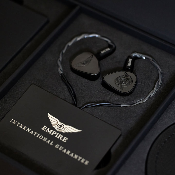 Empire Ears Raven black with attached cable inserted in retail package insert
