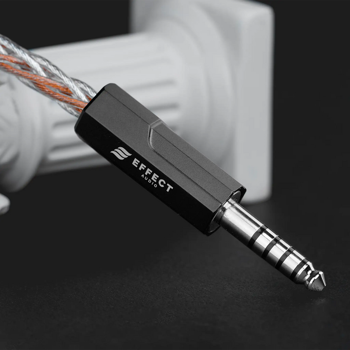 Effect Audio Ares S II x Cadmus II cable termination closeup with white pedestal on dark grey background