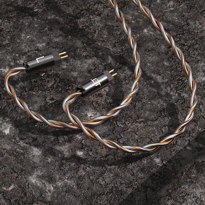 Eletech Odyssey IEM cable connectors on dark stone background