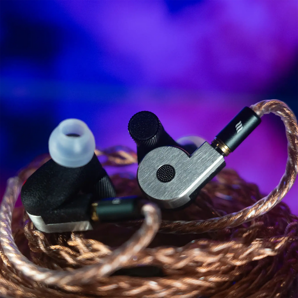 FATfreq x Effect Audio Quantum iems sitting on top of wrapped Ares S II cable on blue/purple backdrop