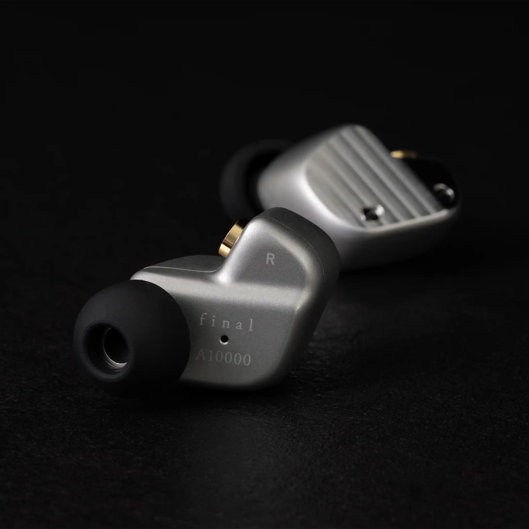 Final Audio A1000 IEMs sitting rear facing and side facing behind on black background