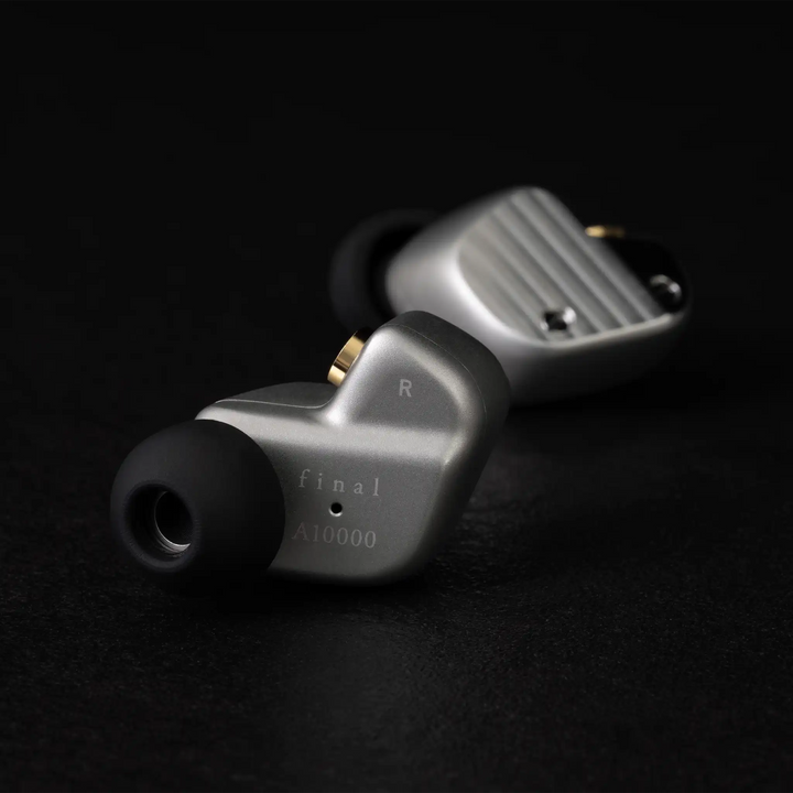 Final Audio A1000 IEMs sitting rear facing and side facing behind on black background