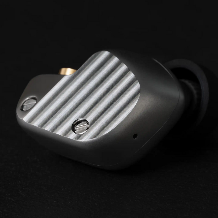 Final Audio A1000 IEM closeup of faceplate wave pattern on black background