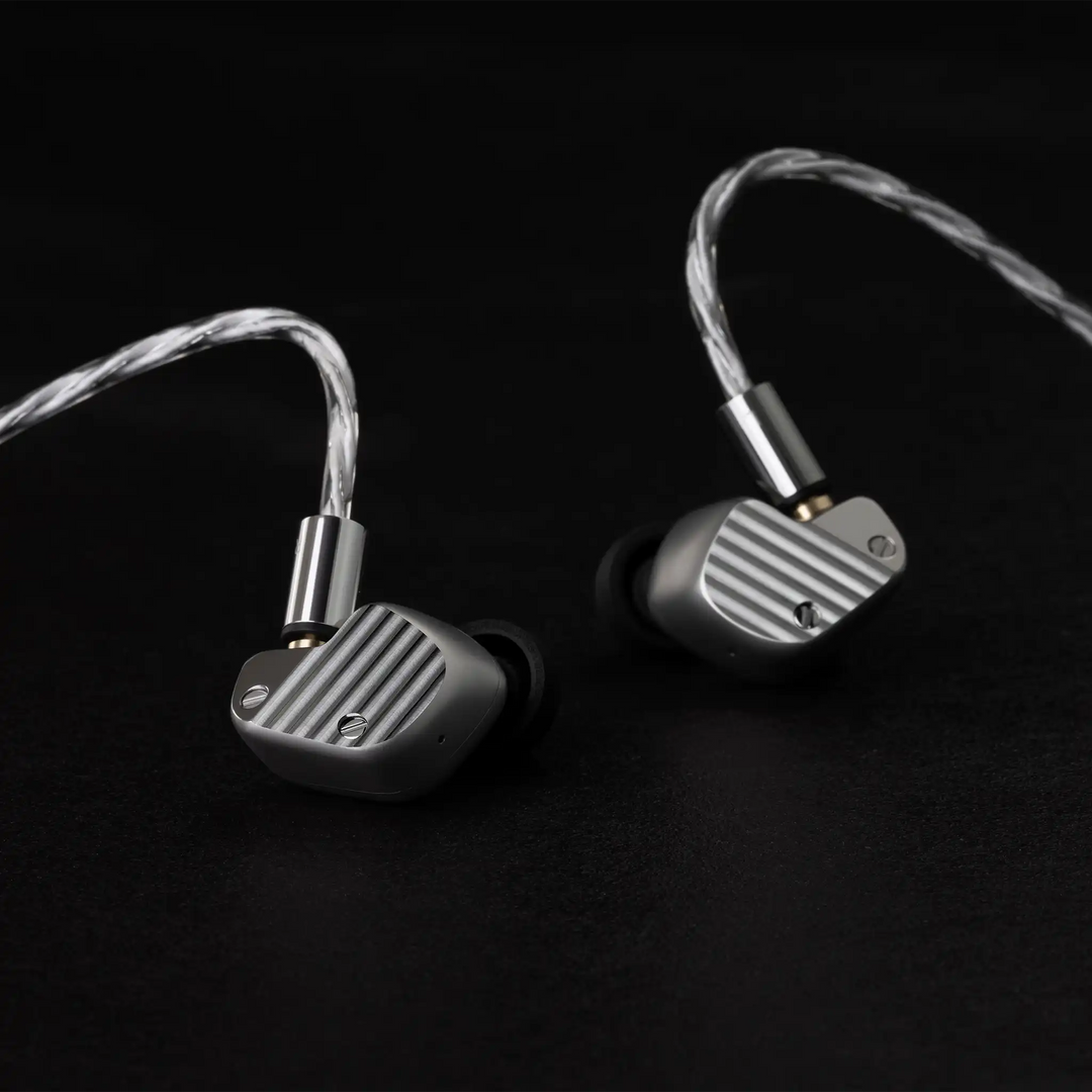 Final Audio A1000 IEMs sitting with cable attached front facing on black background