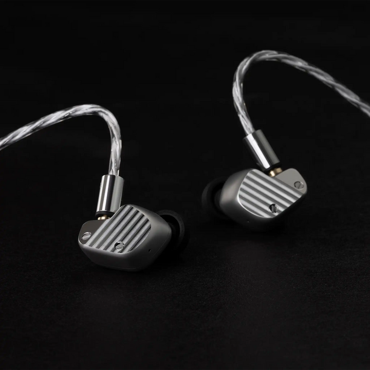 Final Audio A1000 IEMs sitting with cable attached front facing on black background