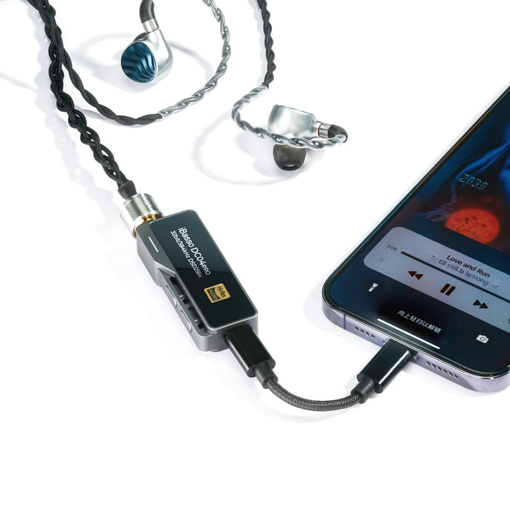 iBasso DC04 Pro gray with attached earphones and iPhone over white background