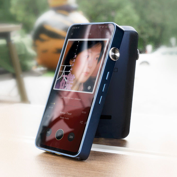 iBasso DX320 blue front 3 quarter with active LED screen and window reflection