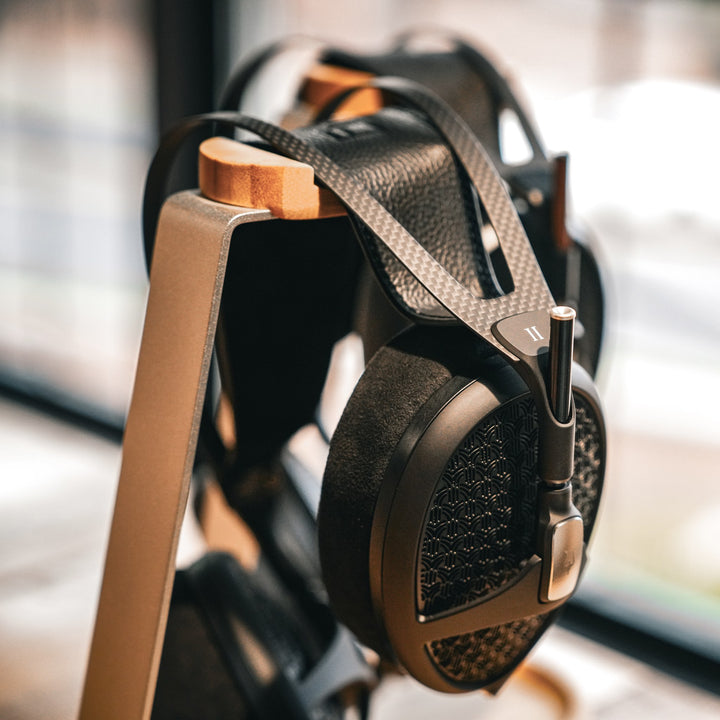 Meze Empyrean 2 warm dramatic hanging over headphone stand