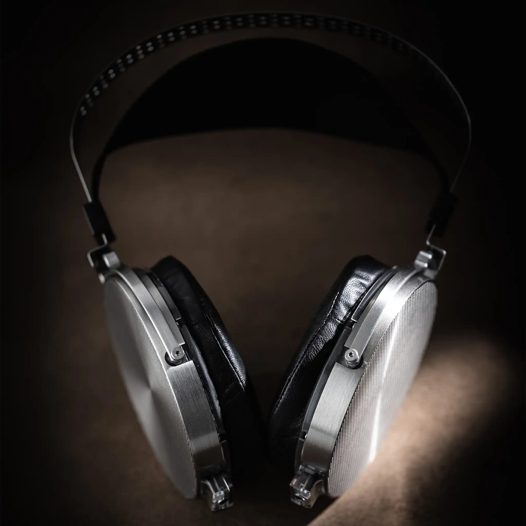 Moondrop Para 2 headphones lying center on brown textured backdrop
