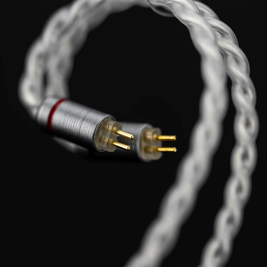 Moondrop Illustrious IEMs 2-pin connectors closeup on black background