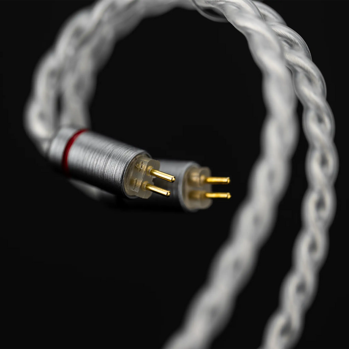 Moondrop Illustrious IEMs 2-pin connectors closeup on black background