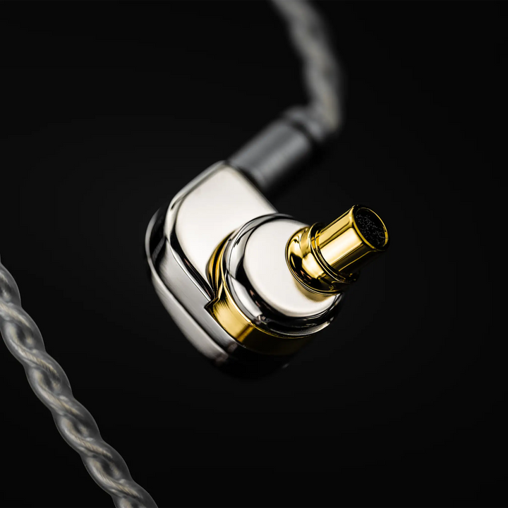 Moondrop Illustrious IEM floating rear view nozzle closeup with cable attached on black background