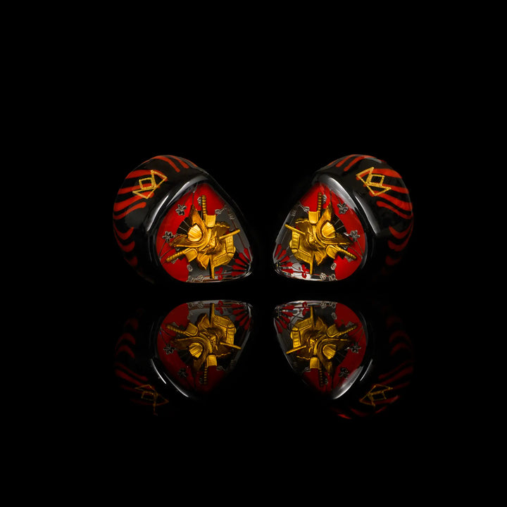 Noble Audio Shogun IEMs sitting center angled inward with reflection underneath on black background