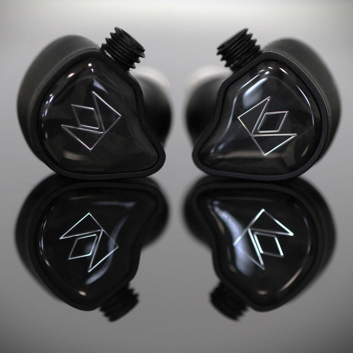 Noble Audio XM-1 front closeup over gray reflective background