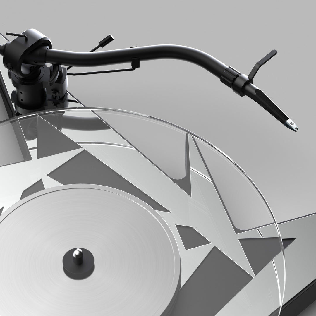 Pro-Ject Metallica turntable closeup tonearm and glass platter over gray background