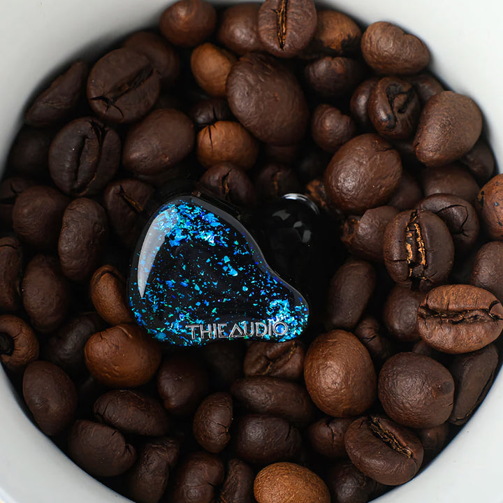 Thieaudio Hype 4 black front in cup of coffee beans