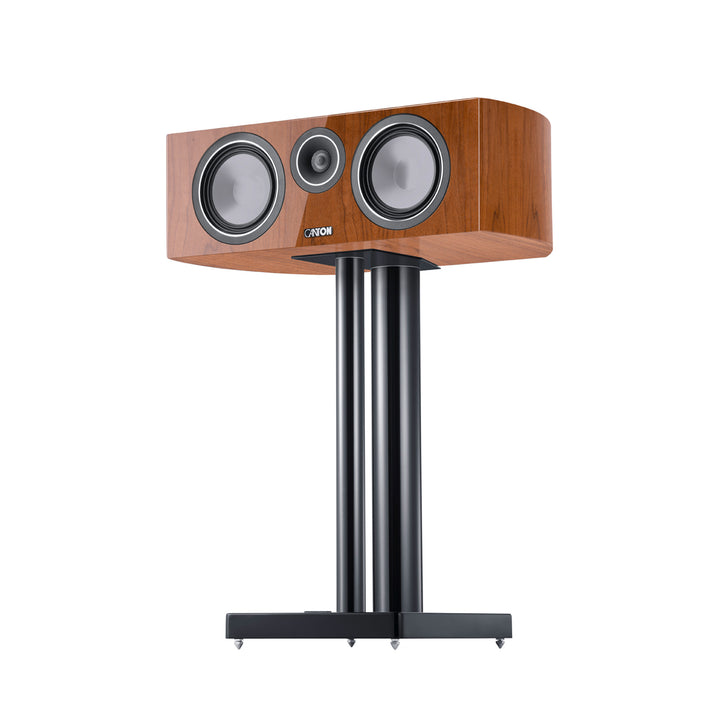 Canton Vento 50 center speaker light walnut 3 quarter on stand over white background