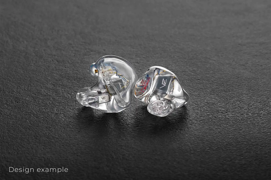 Vision Ears VE ONE IEMs sitting front and side view clear faceplate facing out on dark grey background