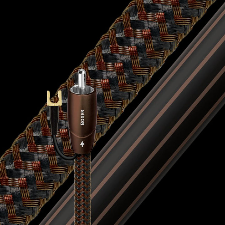 AudioQuest Boxer subwoofer cable highlighting termination and jacket over black background