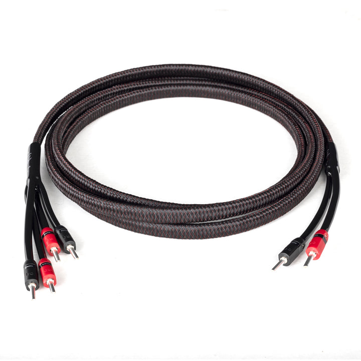 AudioQuest Rocket 33 bi-wire coiled over white background
