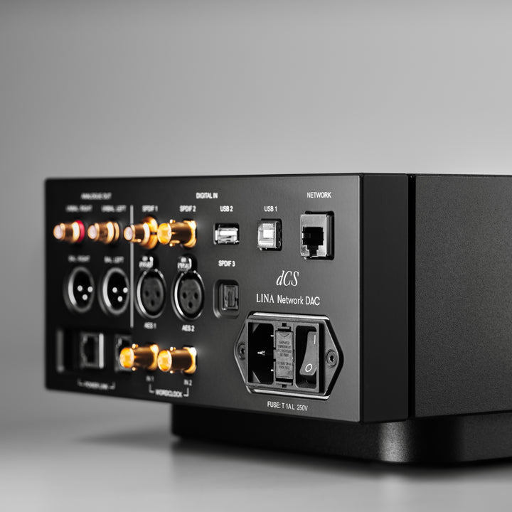 dCS Lina network DAC black right rear quarter over gray background