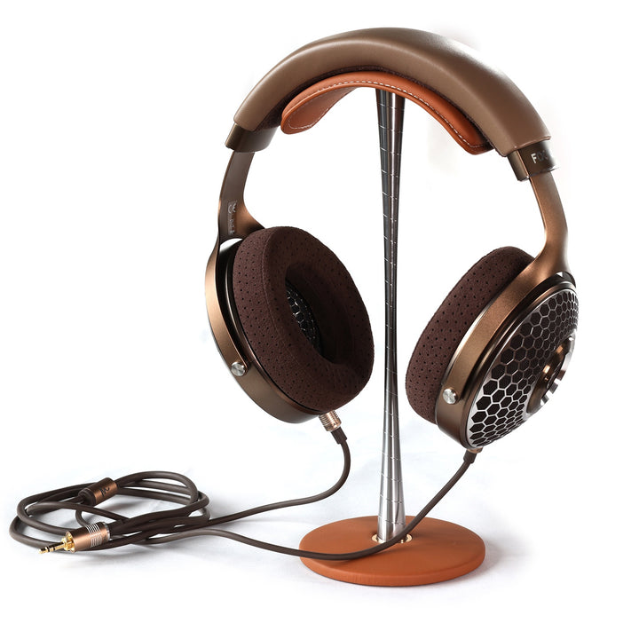 Focal headphones and attached cable on top of ddHiFi brown HS270