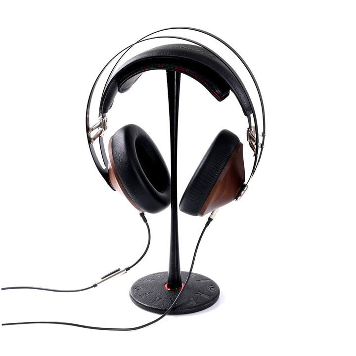 Meze headphones and attached cable on top of ddHiFi black HS270 stand