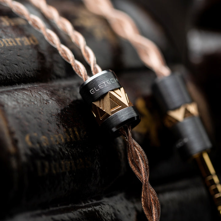 Eletech Azrael copper cable highlighting y-split over vintage books