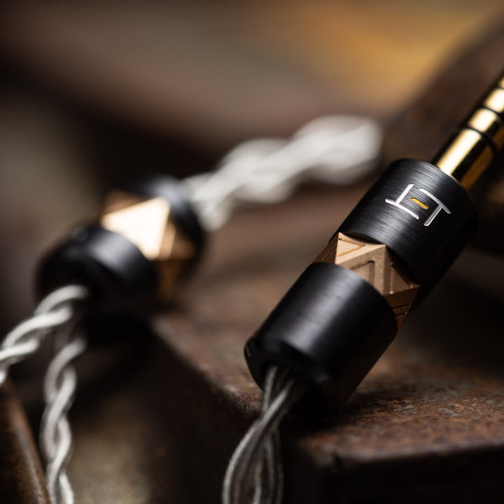 Eletech Cassiel silver cable with closeup of engraved logo