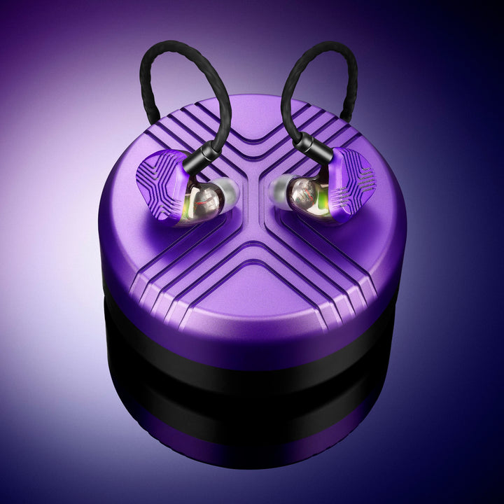 Vision Ears EXT earphones atop case over purple gradient background