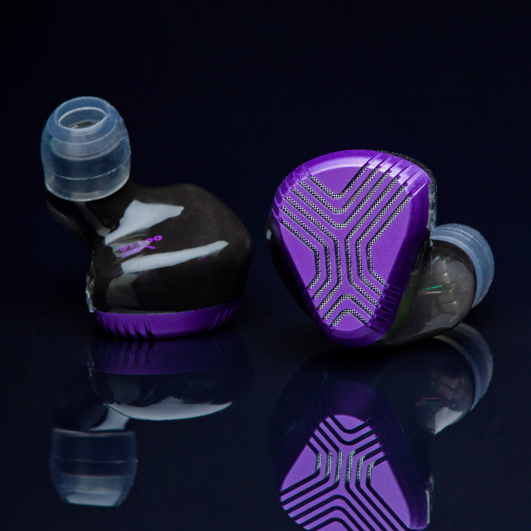 Vision Ears EXT front shell and ear tips over dark reflective background