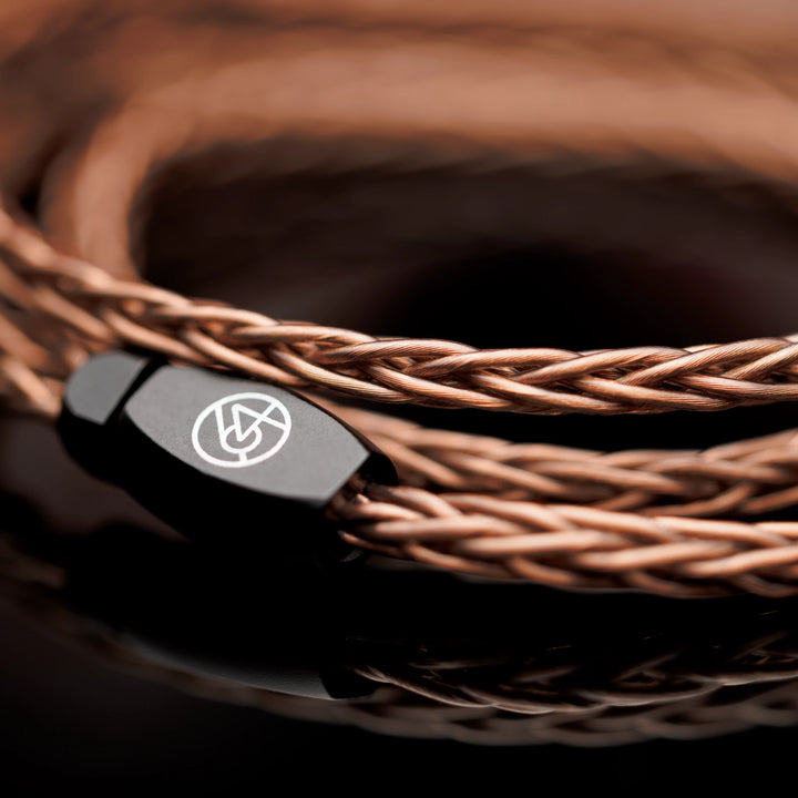 64 Audio Solo coiled stock cable closeup highlighting copper and y-split