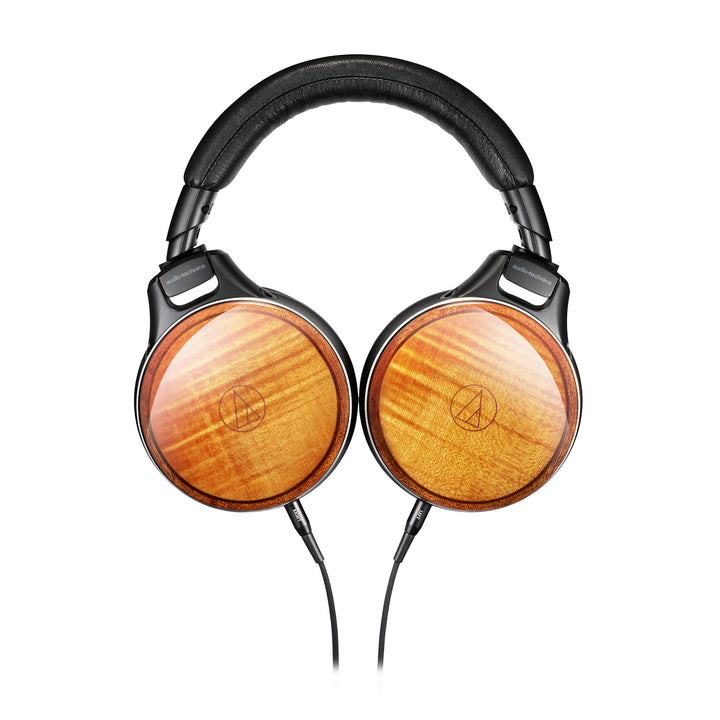 Audio Technica ATH-WBLTD headphone front eye level with rotated earcups highlighting wood whitebox