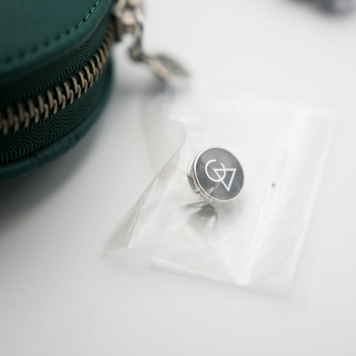 Campfire Audio lapel pin in baggie over white background from Bloom Audio gallery