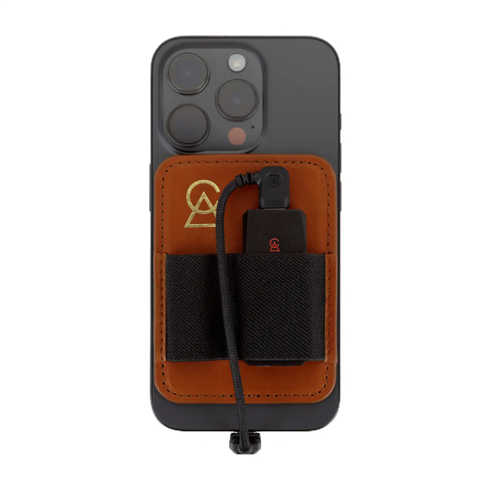 Campfire Audio Portable DAC Wallet attached to back of iPhone with relay DAC inside and custom USB-C cable plugged in whitebox