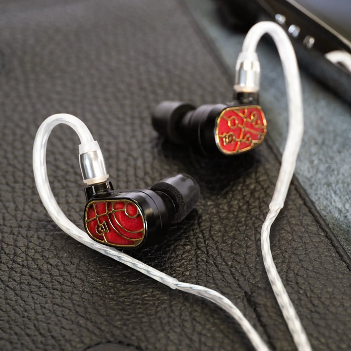 Campfire Solaris Vulcan MV3 pair over black leather with attached Time Stream cable