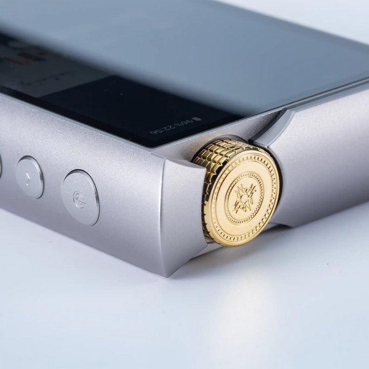 Cayin N7+ DAP lying face up closeup of top right corner gold dial knob whitebox