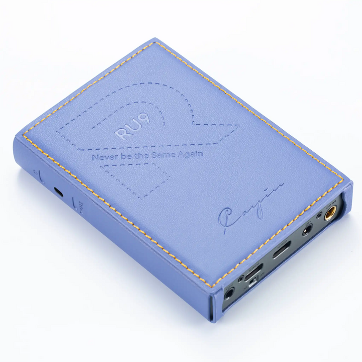 Cayin RU9 DAC/amp lying face down rotated left in leather case whitebox