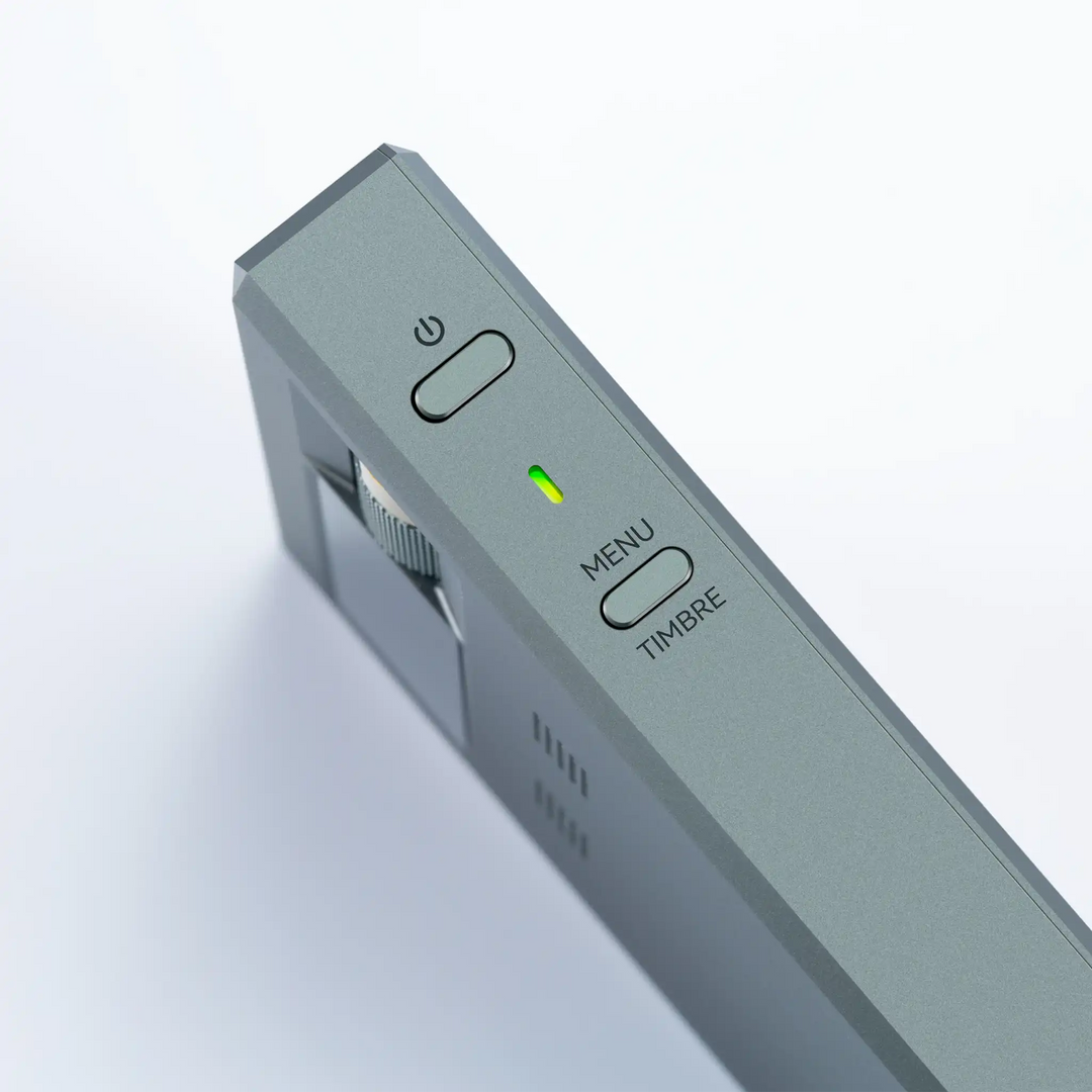 Cayin RU9 DAC/amp standing on left side closeup of power and menu button whitebox