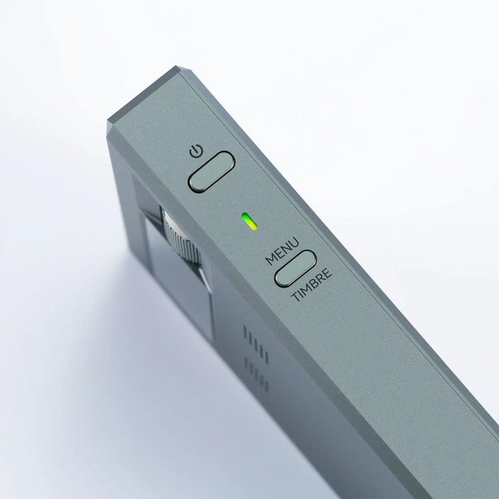 Cayin RU9 DAC/amp standing on left side closeup of power and menu button whitebox