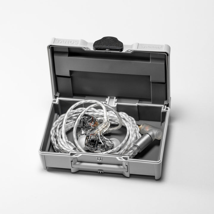 DITA Audio Project M with attached coiled stock cable inside open TANOS case over white background