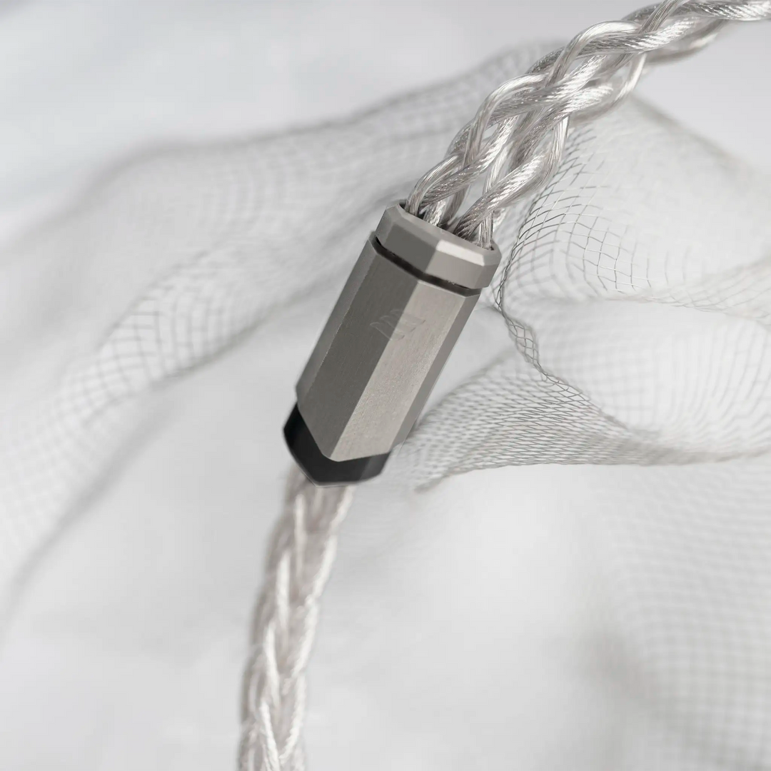 Effect Audio Chiron + Cleopatra II IEM cable y-split closeup on white background with wire mesh