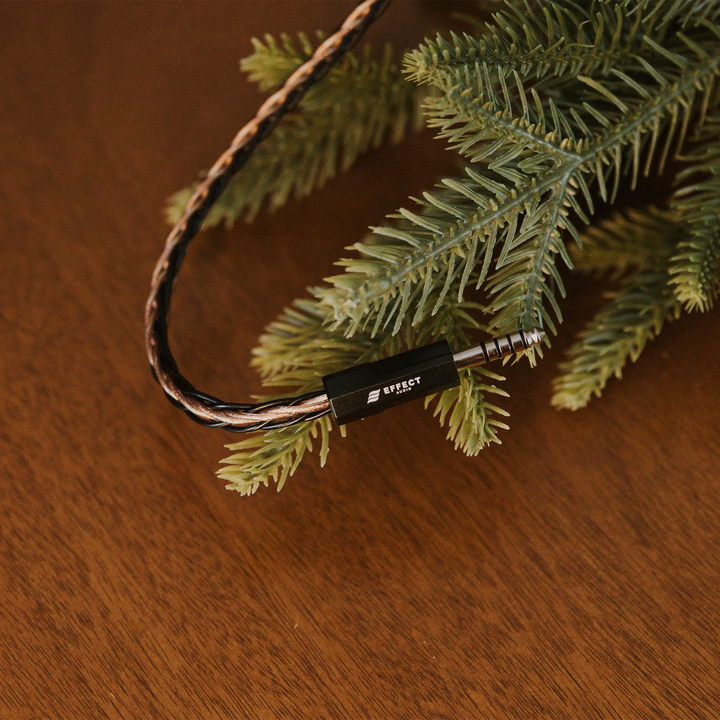 Effect Audio Christmas 2025 cable closeup of termination with christmas tree on wooden table